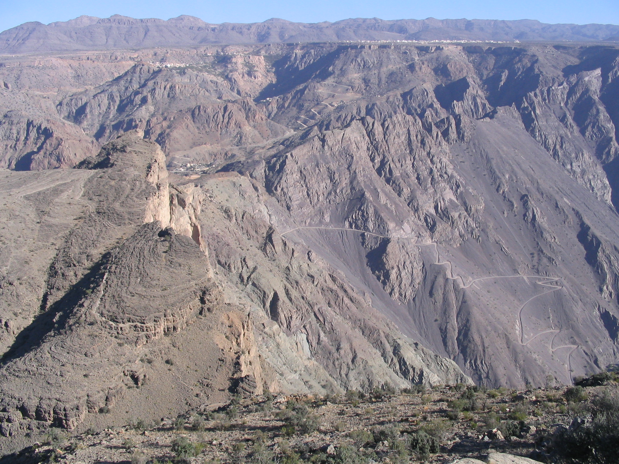 Overview of Wadi Muaydin - the lowest oasis, Masayrat ar Ruwajah, is at the end of the steep, curvy road you can see disappear at the bottom of the image.